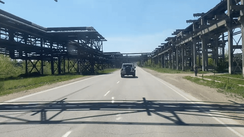 SUV travels industrial road in Angarsk, Russia