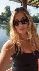 Woman enjoys boat outing near Paris waterway seating area