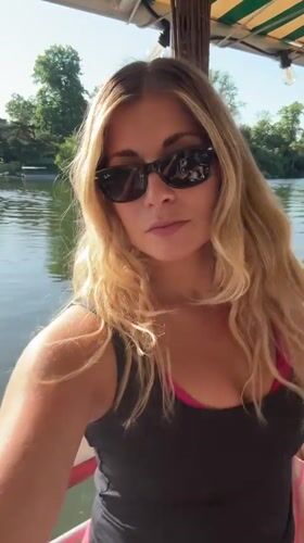 Woman enjoys boat outing near Paris waterway seating area
