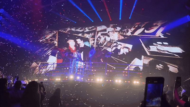 Singer performs under blue lights in Playa del Carmen