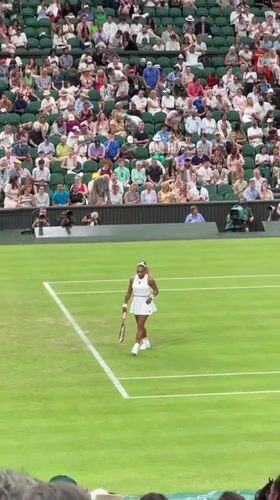 Grass court tennis match, scoreboard showing Serena