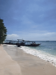 Peaceful morning beach scene documented in Indonesia