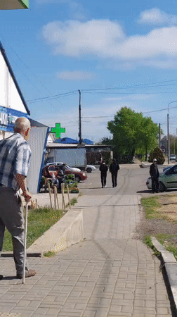 Elderly man with cane observed near dilapidated building in Sennoy
