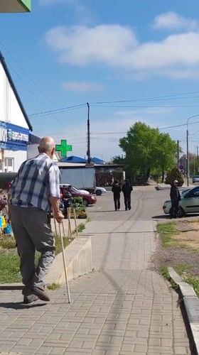 Elderly man with cane observed near dilapidated building in Sennoy