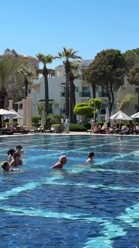 Resort pool activities and selfie captured in Serik, Turkey