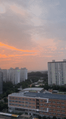 Pyeongtaek-si glows under a dramatic orange and pink sunset sky