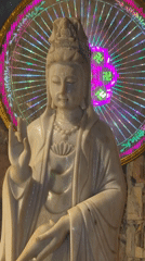 Tourist explores Buddhist cave temples at Marble Mountains, Vietnam