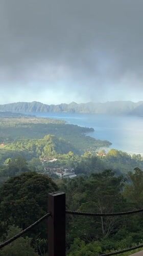 Scenic lake and mountain vista recorded in Kintamani