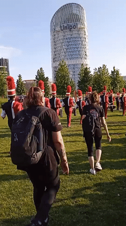 Marching band rehearses in Milan's Porta Nuova park