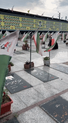Iranian memorial cemetery documented with flags and grave markers