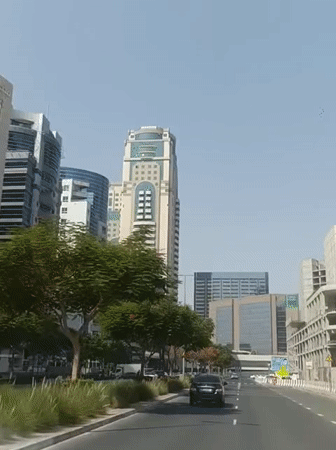 Morning drive through Dubai's urban streets and highways