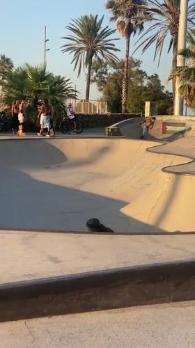 Skating a graffiti-covered concrete bowl in Barcelona
