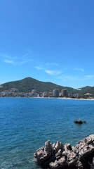 Clear skies frame Budva's coastal waters in Montenegro