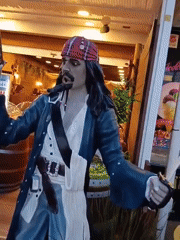 Tourist explores Puerto Del Carmen attractions and streetscapes during evening hours