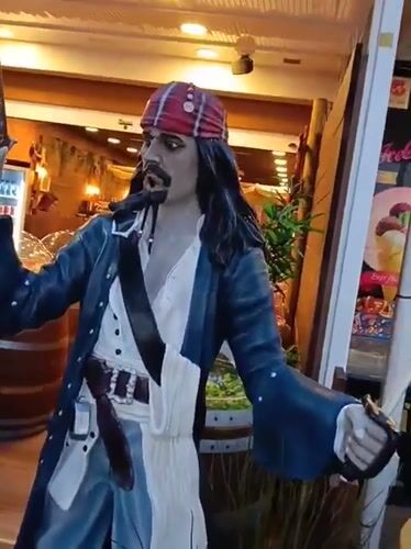 Tourist explores Puerto Del Carmen attractions and streetscapes during evening hours