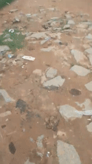 Wet dirt roads and daily movement through Suleja, Nigeria