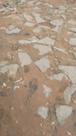 Wet dirt roads and daily movement through Suleja, Nigeria