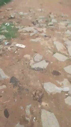 Wet dirt roads and daily movement through Suleja, Nigeria