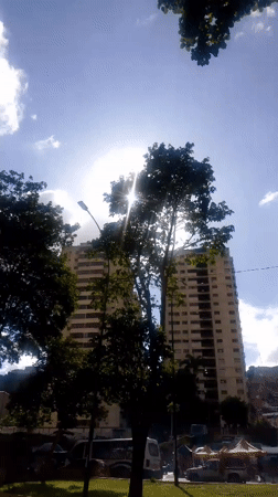 Caracas residential towers and hillside sprawl, day into dusk