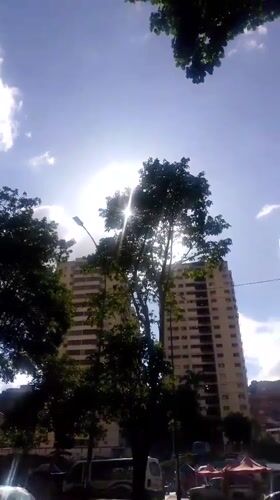 Caracas residential towers and hillside sprawl, day into dusk
