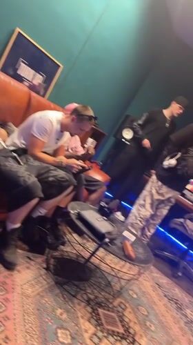 Downtime in a Paris music studio, phones out on the couch.