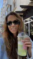 Iced matcha and cheesecake at a sunny Bar café