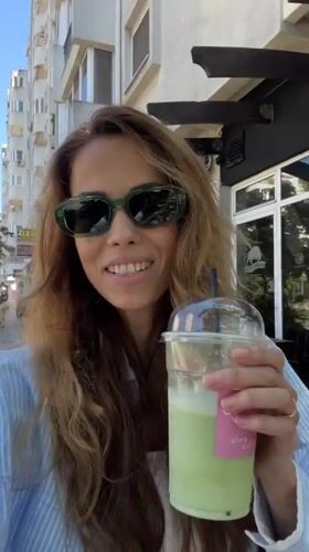 Iced matcha and cheesecake at a sunny Bar café