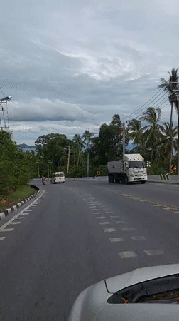 Passenger-seat view of road traffic in Ko Samui