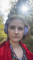 Woman walks corgi through Novosibirsk park during morning outing