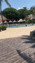 Beachgoers enjoy upscale Playa del Carmen resort amenities