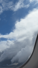 Passenger documents flight experience over Sofia with tablet entertainment