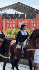 Costumed riders on horseback parade through Pamplona