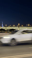 Nighttime bridge view captured from roadside in Saint Petersburg