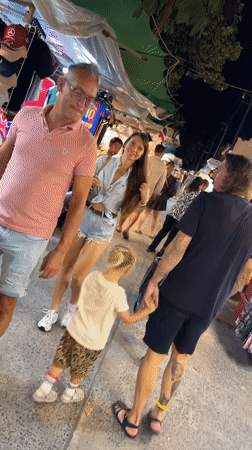 Woman browses outdoor night market in Baan Bo Phut