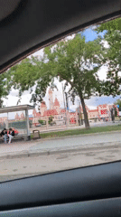 Driver films red-topped towers building in Moscow