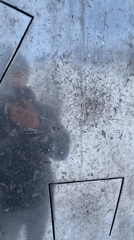 Man enjoys winter activities near metal structures in Murmansk