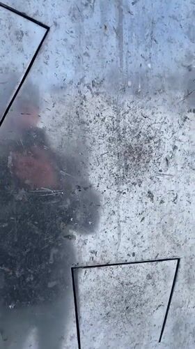 Man enjoys winter activities near metal structures in Murmansk