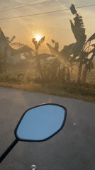 Sunrise ride through rural Kropak, mirrors catching the morning glow