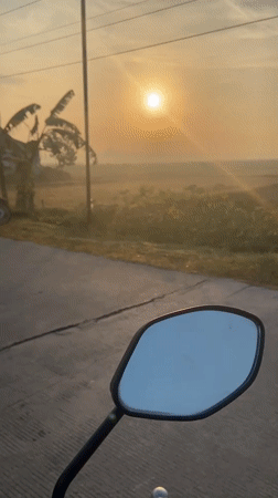 Sunrise ride through rural Kropak, mirrors catching the morning glow