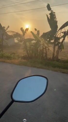 Sunrise ride through rural Kropak, mirrors catching the morning glow