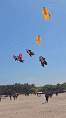 Beach festival with kites and stage in Denpasar