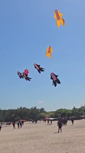 Beach festival with kites and stage in Denpasar