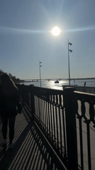 Sunny afternoon stroll captured along Perm riverside promenade