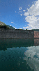 Tourists explore historic Kotor waterfront and mountain walls
