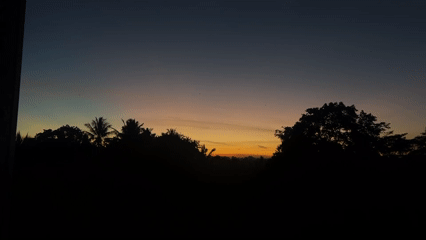 Person captures sunset photos in Kediri, Indonesia