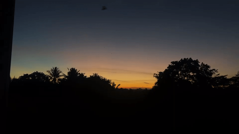 Person captures sunset photos in Kediri, Indonesia