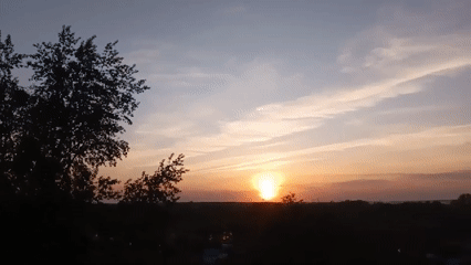Witnesses document sunset to moonrise transition over landscape