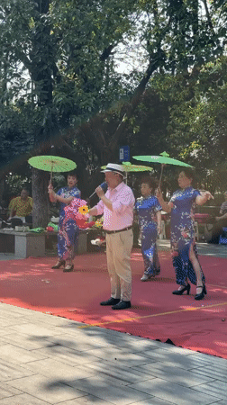 Street performers stage outdoor show in Qingyang District park