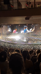 Live concert in New York, multiple performers on stage