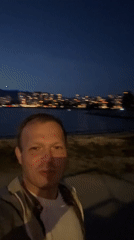 Man films nighttime selfie at Vancouver waterfront